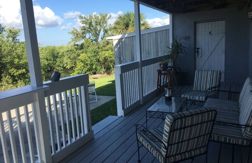 New Smyrna Beach Apartment | Sun Surf Shell Repeat.n99 Steps to Ocean!nPrivate, Serene Special 6 month rate.