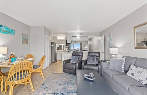 Thomas Drive Condo | Sunkissed Bliss Steps to Sand 2nd Floor Beachfront + Free Chairs+Tikki Bar