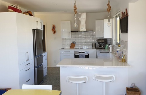 Te Horo Beach House | Sunny bach on beachfront with heaps of room and lots to do