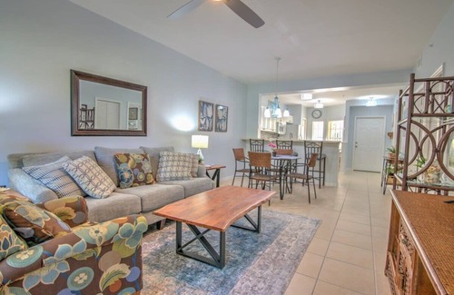 Ole Condo | Sunny Coral Falls With Vibrant Tropical Colors