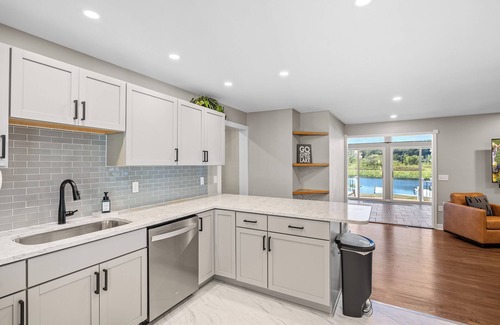 La Porte House | Sunset Shores - Lakefront Home with Hot Tub and Fire Pit