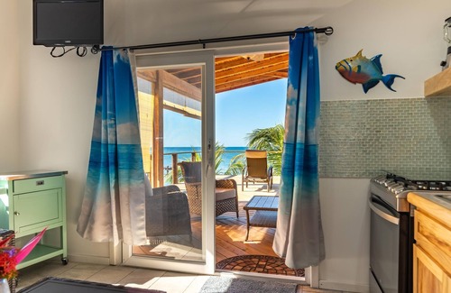 Sandy Bay Hotel | Sunset View Condo @ The Blue Bahia Resort in Sandy Bay