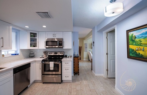 Sunshine Estates Apartment | Sunshine Villa | Bayfront apartment with pool, dockage, and sunsets!
