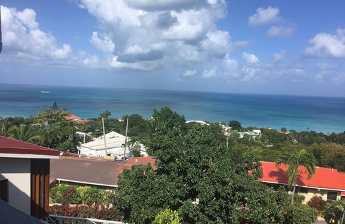 Dickenson Bay Apartment | Swimming Pool- Balcony/Veranda- Sea & Sunset Views