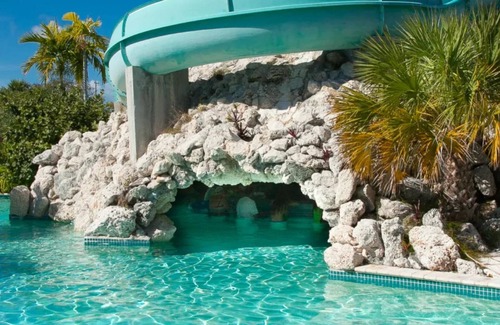 Greening Glade Resort | Taino Beach Bahamas 1 or 2 bedroom suite poolside with covered patio and beach