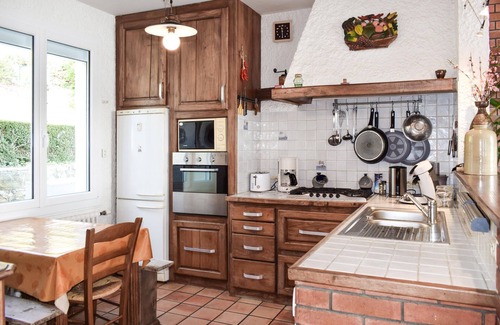 Plouguiel House | Take a vacation in this beautiful country house with rustic furnishings and a view of the water.