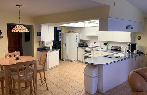 Riverview House | Tampa area home with solar-heated pool, hot tub, river and large dock.