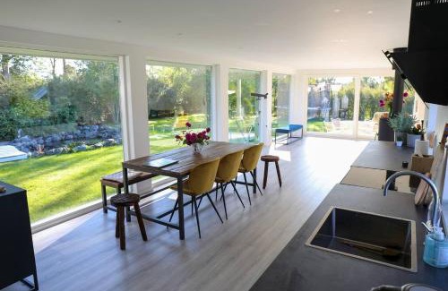 Holbaek House | The comfort of this cottage merges with nature