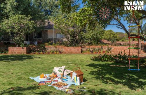 Bajarwadi Villa | The Deck by StayVista - Country house architecture with Valley View
