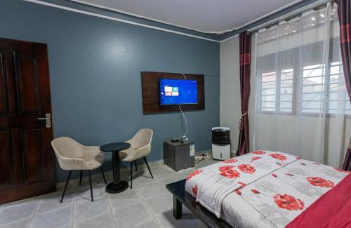 Soroti Apartment | The Den Soroti Red & White
