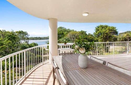 Currimundi Apartment | THE ENTRANCE UNIT 5 - Relax on a sunlit balcony overlooking Currimundi Lake, with birds singing in t
