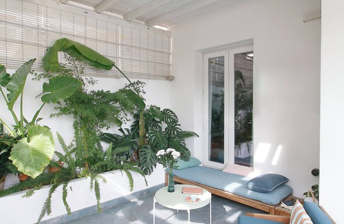 Puerta del Angel Ski Chalet | The house, two floors and jungle patio.