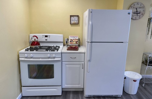 Winchester Apartment | The Inn at Highland Lake, 1st Floor, waterfront yard with a boat dock