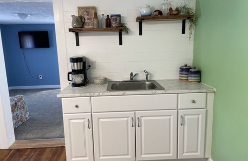 Winchester Apartment | The Inn at Highland Lake, 2nd Floor, waterfront yard with a boat dock