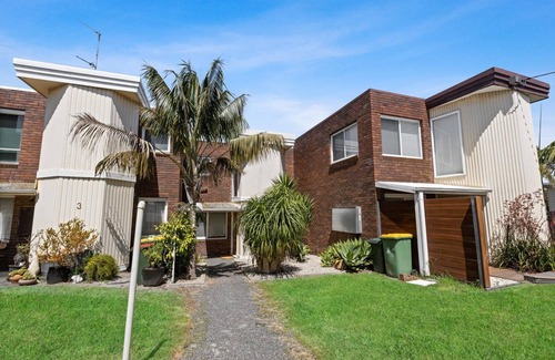 Paynesville House | The Lake Villa - Enjoy views over the treetops of downtown as you relax