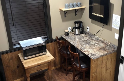 Weaverville House | The Loft King Room w/full kitchen in historic Carriage House building.