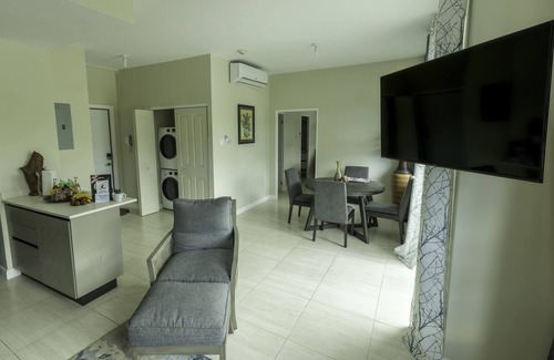 New Kingston Condo | "The Oasis" PH 1 BR with AC, WiFi, complimentary Netflix & 24/7 security.