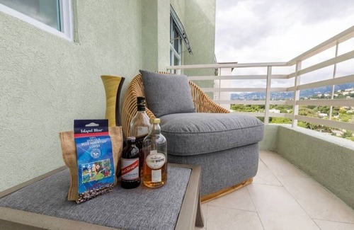 New Kingston Condo | "The Oasis" PH 1 BR with AC, WiFi, complimentary Netflix & 24/7 security.