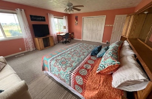 Rexburg Bed & Breakfast | The Orange Room at the Salem House Deluxe private Bedroom in shared living space