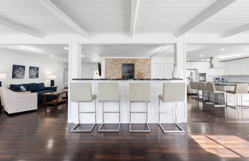 Bahama Palm Shores House | The Paradise. Beachfront property with a pool; accommodates 14 guests.