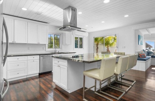 Bahama Palm Shores House | The Paradise. Beachfront property with a pool; accommodates 14 guests.