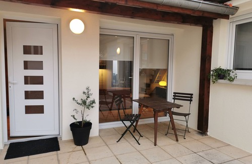 Poteries Apartment | "the patio" outdoor space, air conditioning and calm.