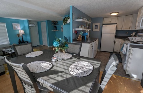 Edgewater House | The Tiki Hut Oasis, a tropical Beach home with firepit, patio, and more!