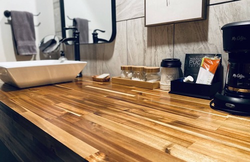 Wellston Bed & Breakfast | The Woods Suite #302 Free Arcade, Movie Theater, Patio Area, Playground and more