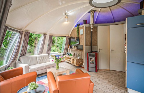 Municipality of Alphen-Chaam House | These detached bungalows with domed roofs are scattered in a wooded resort.