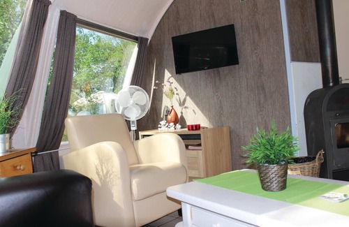 Municipality of Alphen-Chaam House | These detached bungalows with domed roofs are scattered in a wooded resort.