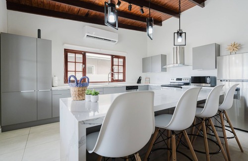 Pos Chiquito House | This beautiful 4-bedroom, 3-bathroom home is just a 2-minute walk from the crystal-clear ocean.