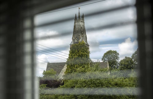 Minchinhampton Cottage | This charming Cotswold stone cottage, elegantly furnished with a seamless blend of antique and conte