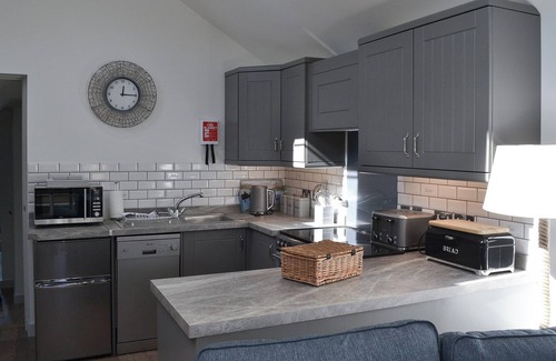 Treator Cottage | This ground floor apartment benefits from it’s own private decked area.