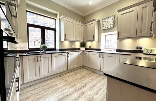 Haworth Apartment | This luxury, boutique style, stone built, 3 bedroom, 2 bathroom apartment by Above Rubies sits directly on Haworth’s renowned cobbled Main Street and is only a stone’s throw from the iconic Parsonage, home to the Brontë sisters.