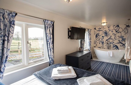 Castle Carrock Cottage | This luxury lodge has its own decking with hot tub