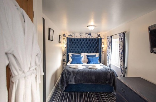 Castle Carrock Cottage | This luxury lodge has its own decking with hot tub