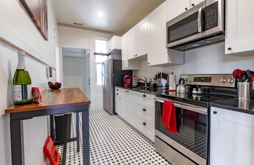 Central City Apartment | Top Floor Fast Internet Huge Patio Near Downtown