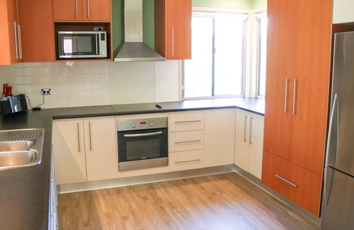 Urangan House | Top Tier Modern split level, pet-friendly family holiday home on the Esplanade with dog-friendly