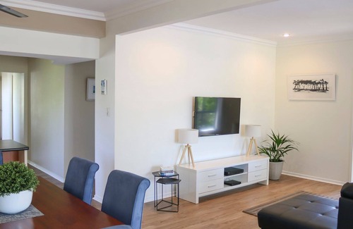 Urangan House | Top Tier Modern split level, pet-friendly family holiday home on the Esplanade with dog-friendly