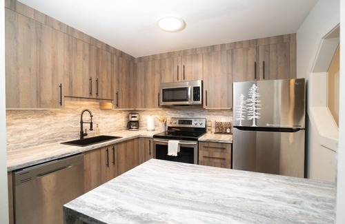 Village North House | Townhouse in Village: Private Hot tub! King Bed, Snowshoes, Bikes + Free Parking