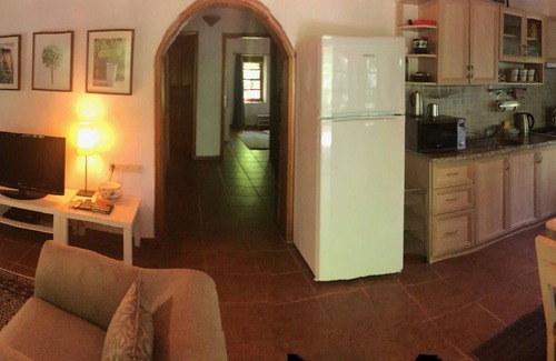 Kayakoy Cottage | Traditional stone cottage with stunning garden in historic Kaya village.