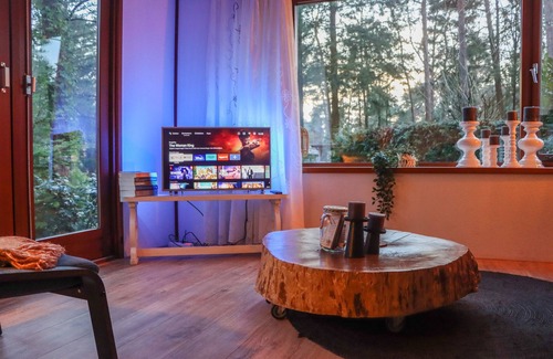 Municipality of Elburg Ski Chalet | Tranquil forest chalet by pond in Veluwe, pet-friendly & sleeps 4