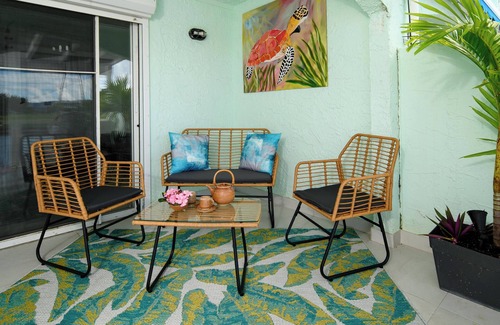 Jolly Harbour Villa | Tranquil Waterfront Villa ~ steps from the Beach, with bikes and terrace views