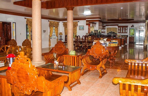 Malitbog Resort | Treasure Bay Dive Resort is set between a scenic forest view and vast calm sea.