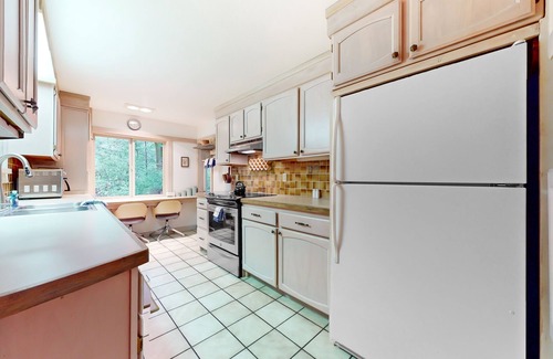 Burley House | Tree-lined retreat with wood fireplace, board game collection, & pool access