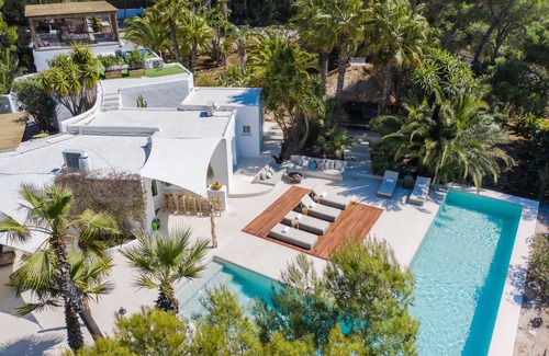 Sant Antoni de Portmany Villa | tropical luxury villa, 6 bedrooms ensuite + service room, sea/sunset views
