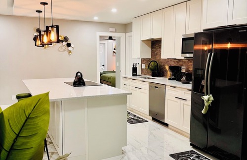 West Palm Beach Villa | Tropical Luxury Retreat with warm Pool, Spacious 5-bedroom & Mini Golf