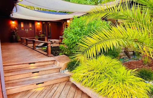 Cascade House | Tropical Riverhouse Retreat