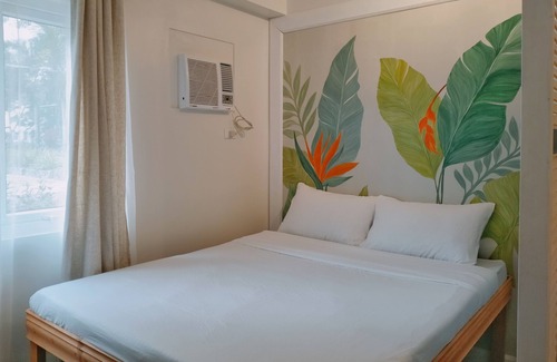 Guadalupe Apartment | Two separate studio units on the same floor of a midrise condominium building.