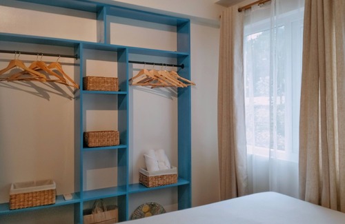 Guadalupe Apartment | Two separate studio units on the same floor of a midrise condominium building.
